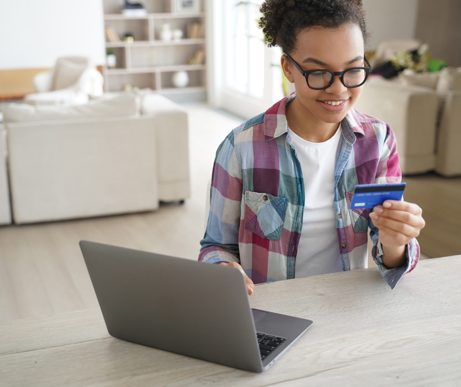 Image of Teen using Laptop with Credit Card